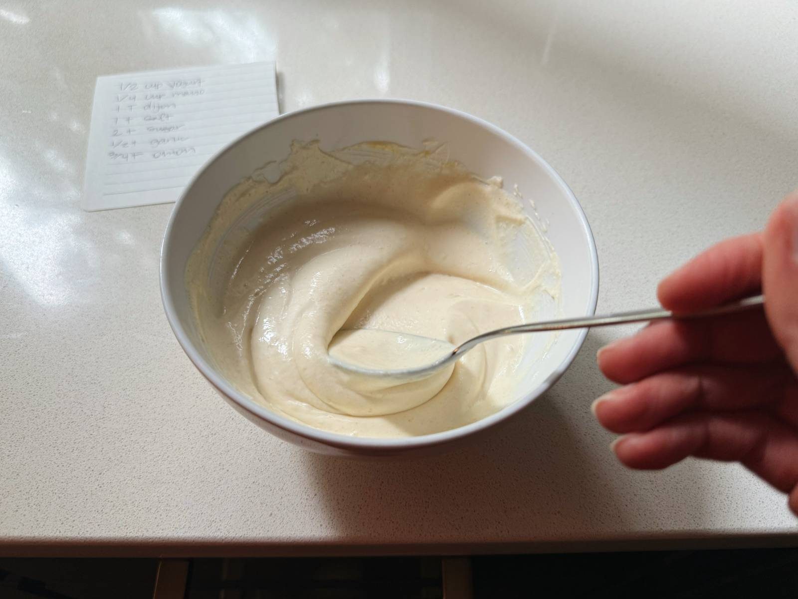 Mixing up dressing for chicken salad.