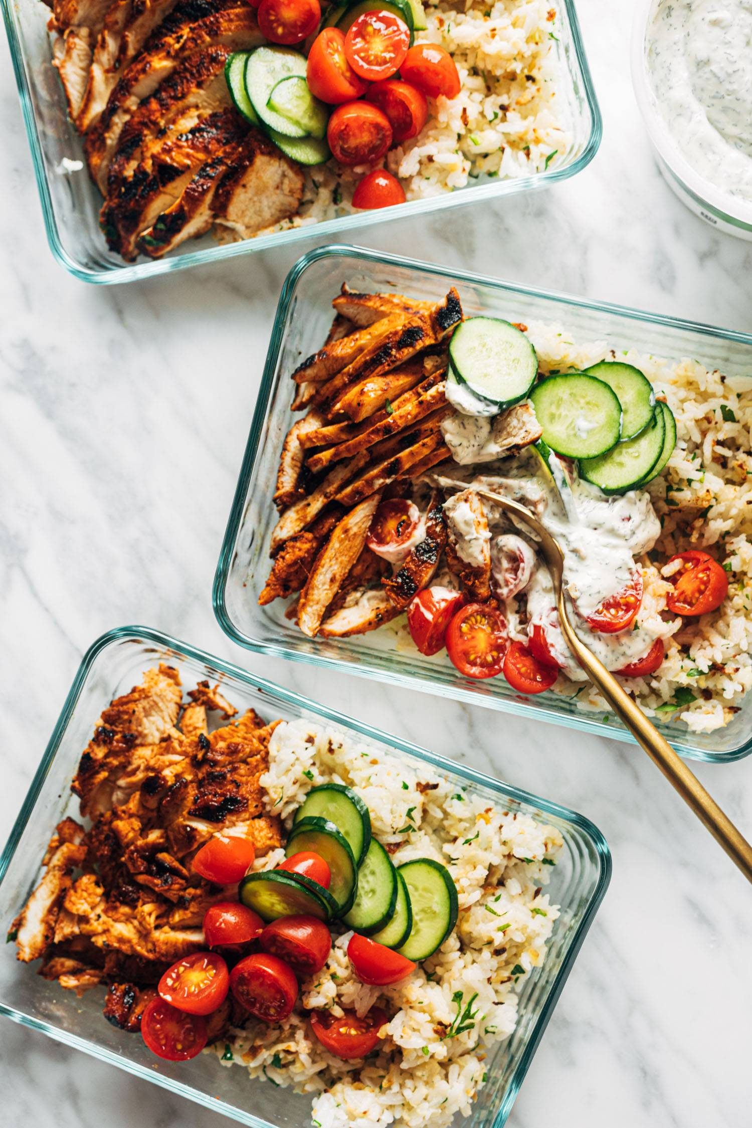 Buffalo chicken bowls in containers.