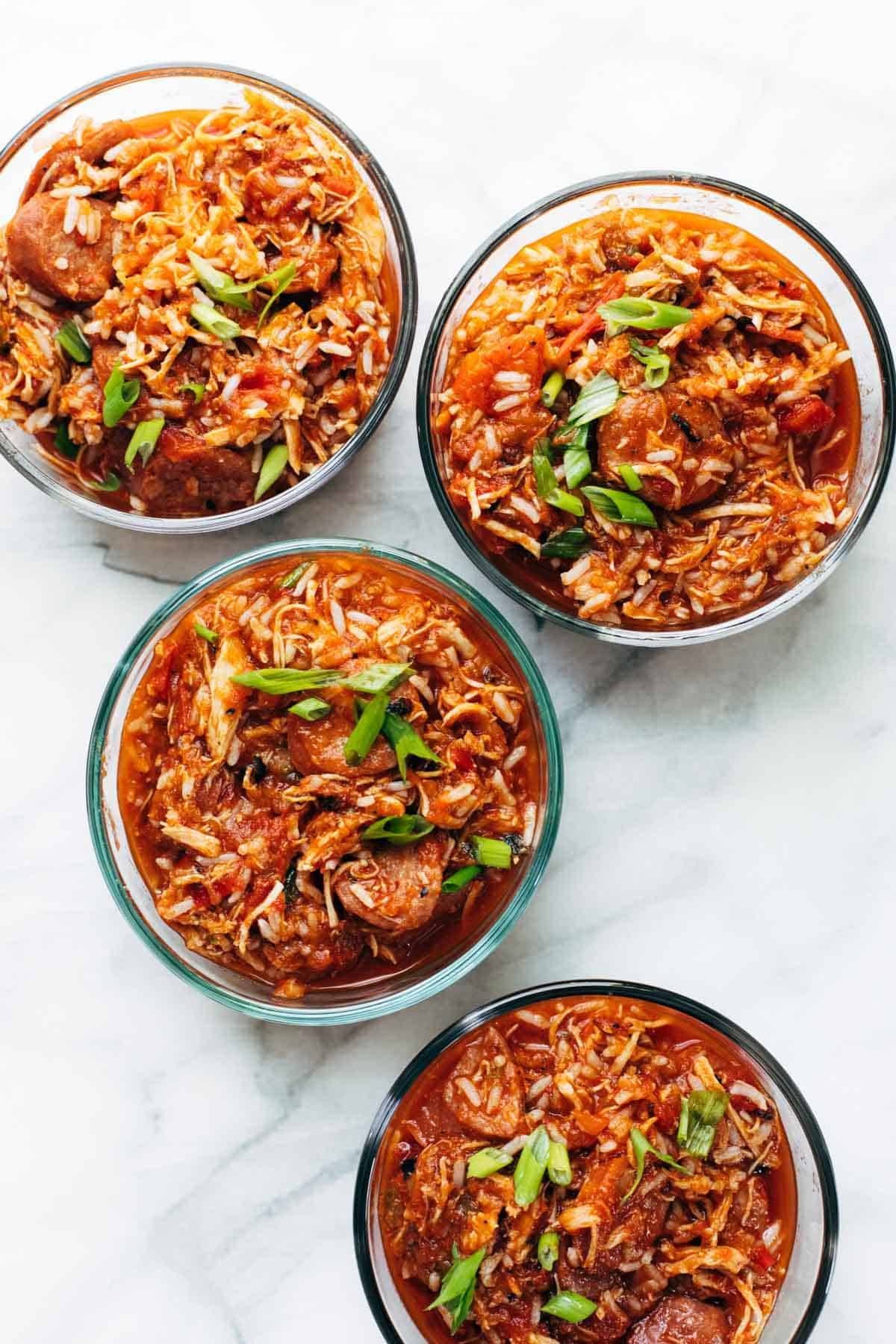 Creole chicken and sausage in containers.
