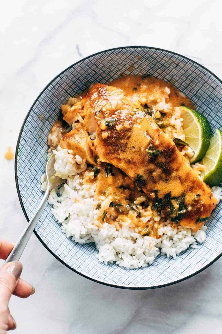Coconut curry salmon in a bowl with rice.